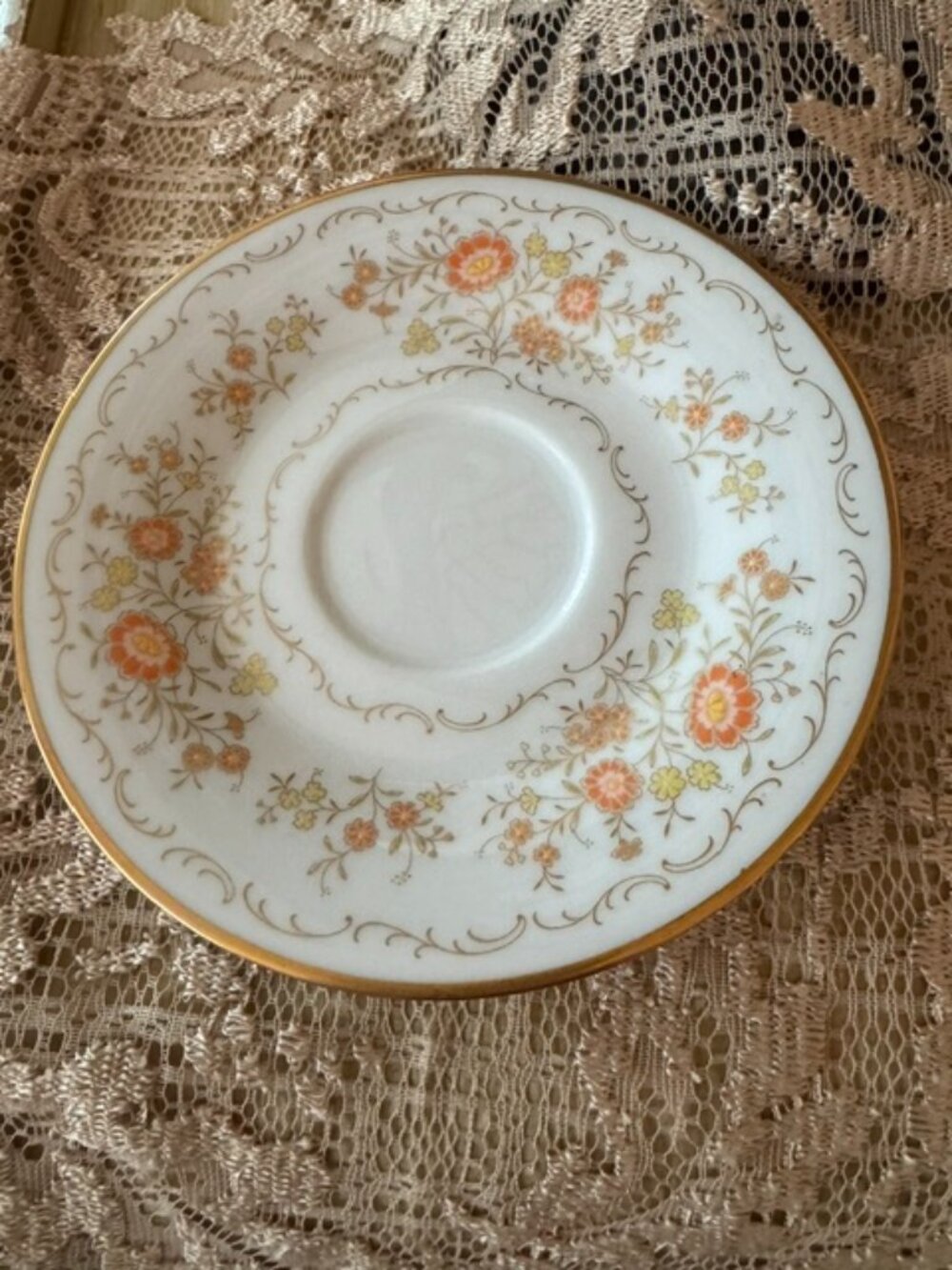 Vintage Noritake porcelain saucer in the "Inspiration" floral pattern.